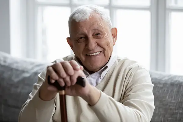 A portrait of a senior man smiling, showing off his healthy teeth. A portrait of a senior man smiling, showing off his healthy teeth.